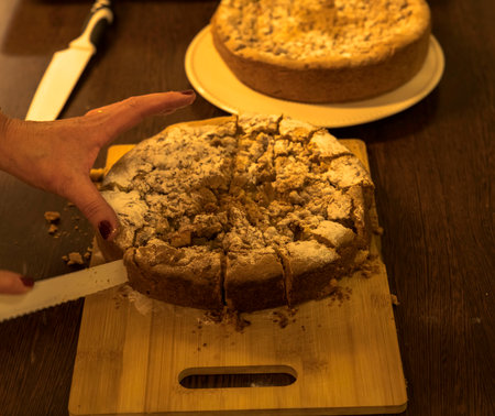 two apple pies on the table, one of which is cut