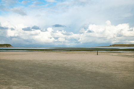 sandy beach from the island texel with dunes on both sidesの写真素材