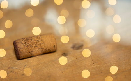 bokeh background with a cock on wooden plateの写真素材