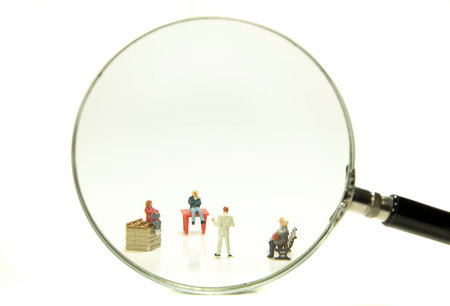 the search for new people, standing out off the crowd, nowadays search with a magnifying glassの写真素材