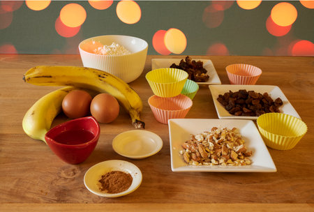 counter top full of ingredients for making cupcakesの写真素材