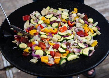 bowl with various fresh vegetables in different colorsの写真素材