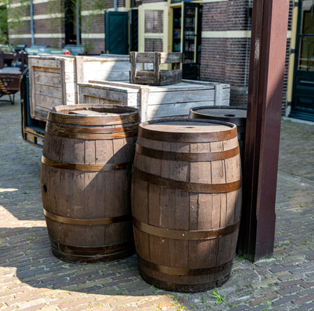 some wooden wine barrels outside in the sunの写真素材
