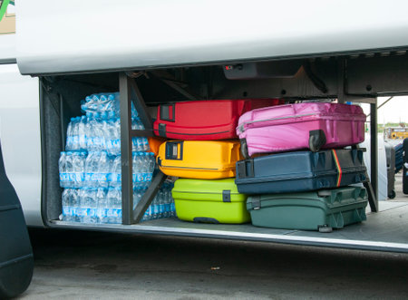 bus full of luggage and bottles of fresh water for a bus tripのeditorial素材