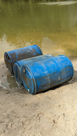 water pollution and environmental pollution by dumping blue waste in this case Drums in the water