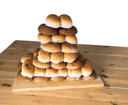 rolls in white and brown from a bakery on a stack with transparent backgroundの写真素材