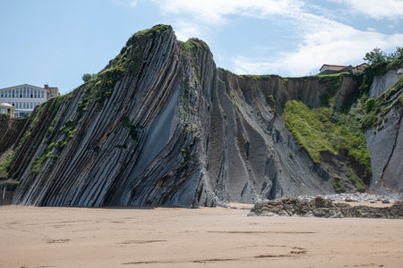 beautifull itzurun beach or zumaia beach in spain in spring with big rocks with layersの写真素材