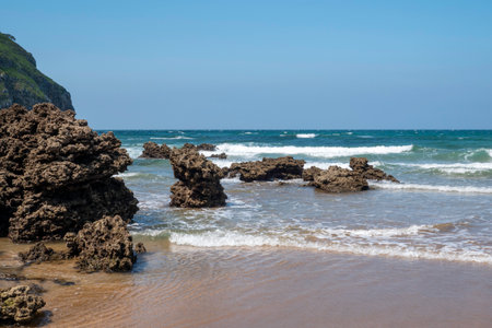 beautiful rock formations and the sea in the background at Playa de Sonabia along the Atlantic coast...