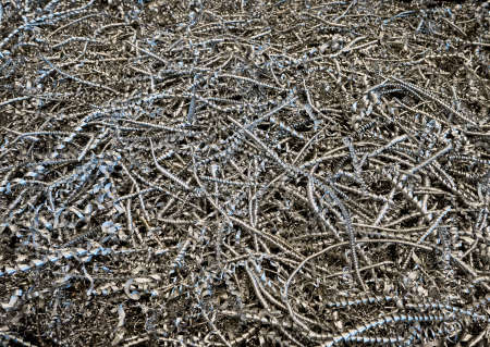 A lot of metal shavings close-up. Metal shavings abstract texture. High quality photoの写真素材