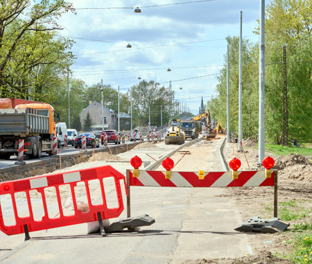 RIGA, LATVIA - MAY 13, 2022: Blocking barriers on the road repair. Heavy traffic on Deglava street....