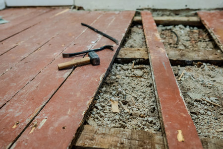 Old wooden floor repairing. Old planks on the floor.の写真素材