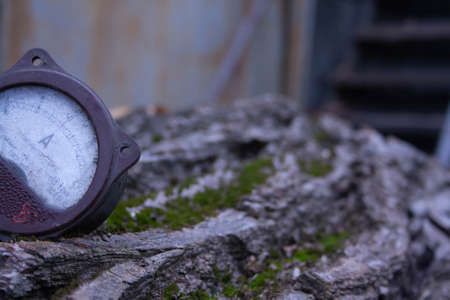Close up of analog ammeter on the wood backgroundの写真素材