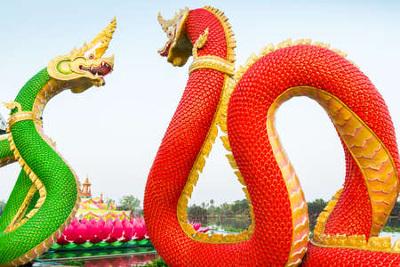 Red and green serpent statue  at Saman Rattanaram Temple, Chachoengsao Province, Thailand の写真素材