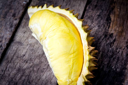 Yellow durian on the woodの写真素材