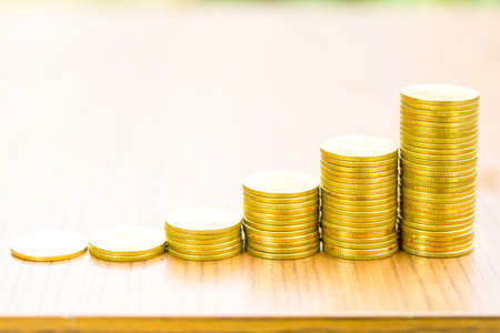 Growing bussiness gold coin graph conceptの写真素材
