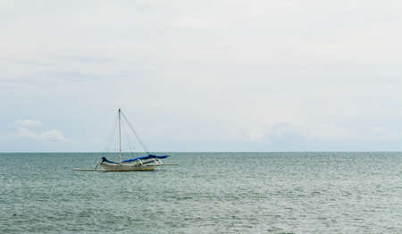 Sailboat sailing in the sea at samui islandの写真素材