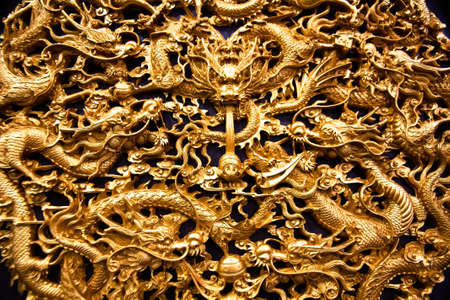 Golden dragon sculpture carving in temple, thailandの写真素材