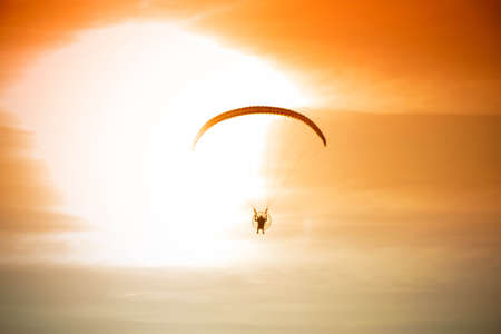 silhouette of para motor gliderの写真素材