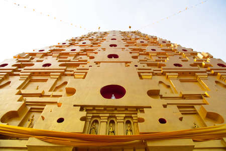 golden pagoda at buddhist temple in Kanchanaburi Province, Thailandの写真素材