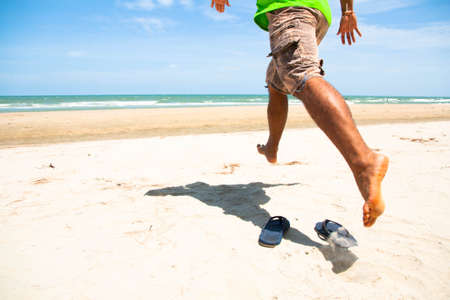 Running into the seaの写真素材