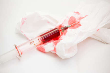 Syringes and bloody paperの写真素材