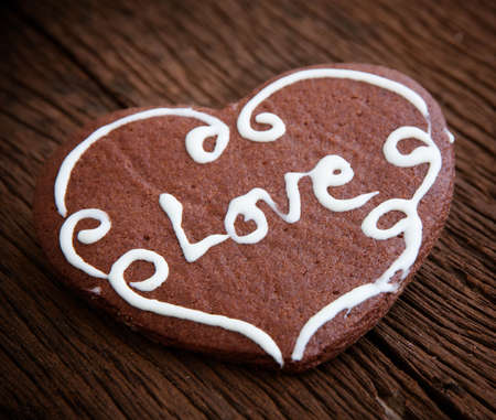 Heart cookie on wood backgroundの写真素材