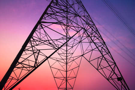 High voltage post and sky in twilight timeの写真素材