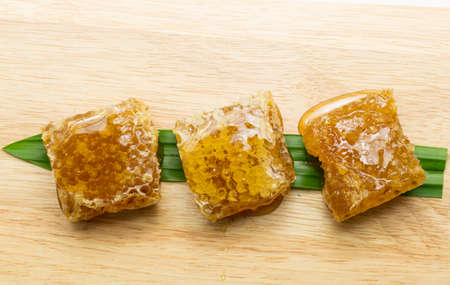 honey on wood backgroundの写真素材