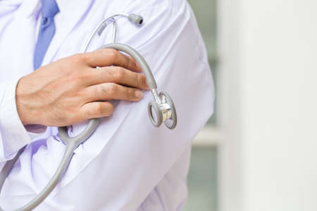 Doctor with stethoscope in a hospitalの写真素材