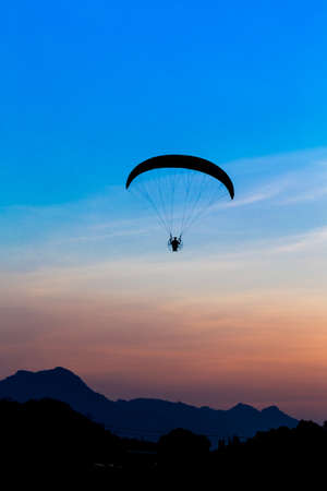 Paramotor flying in the skyの写真素材