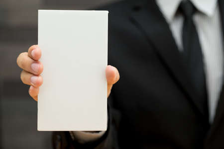 Businessman showing blank signboardの写真素材