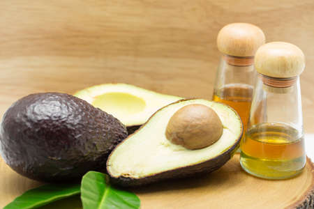 Avocado oil on wood backgroundの写真素材