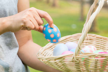 Hand of woman holding easter eggs