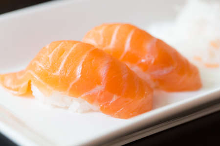 Sushi salmon on white plateの写真素材