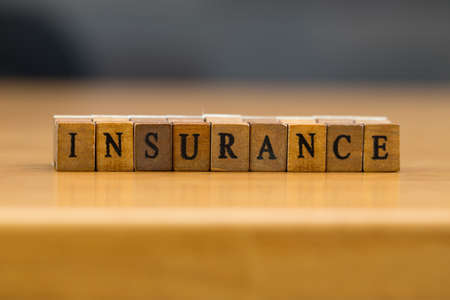 Insurance. word written on wood blockの写真素材