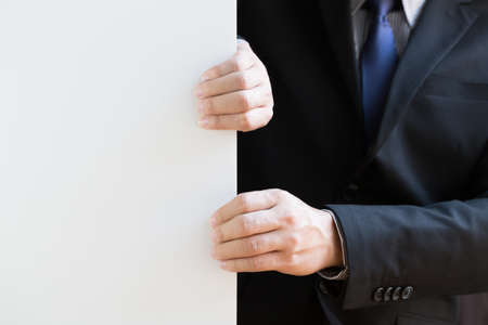 Hand of businessman pull white backgroundの写真素材