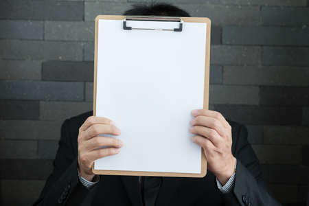 Businessman showing blank documentの写真素材
