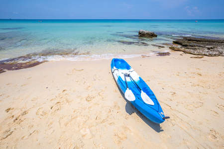 Beach and blue canoe at Koh kood island, Trat province, Thailandの写真素材