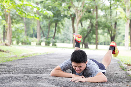 Sport accident injury. stumble and fall while joggingの写真素材
