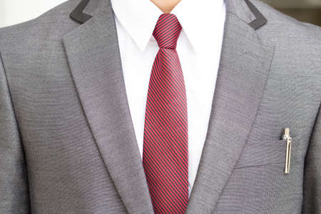 Man in gray suit and red necktieの写真素材
