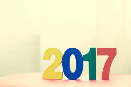 Happy New Year 2017 from wooden character, vintage color styleの写真素材