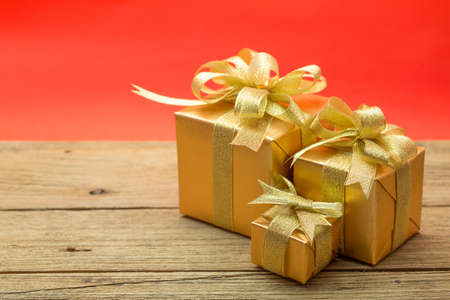 Christmas gift box on wood backgroundの写真素材