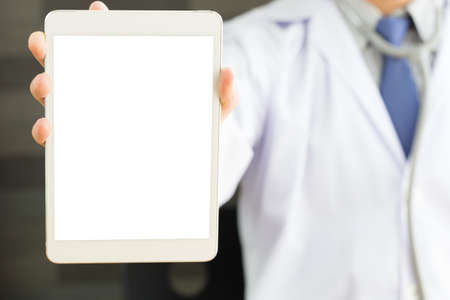 Male doctor hands holding tablet pcの写真素材