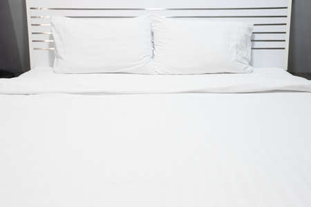 White bed sheets and pillowsの写真素材
