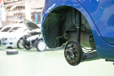 Car with removed wheelの写真素材