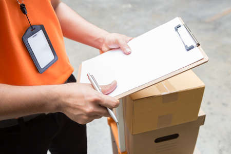 Delivery man with box and prepare to send for customerの写真素材