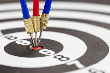 Arrows hitting the center of a target board, concept of partnershipの写真素材