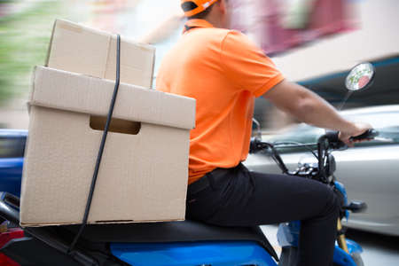 Delivery man ride motorcycle service, Fast and Free Transportの写真素材