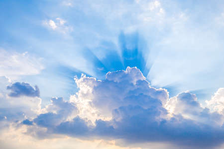 Blue sky with clouds and sunlight reflectionの写真素材