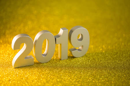 Happy new year 2019 on golden bokeh background